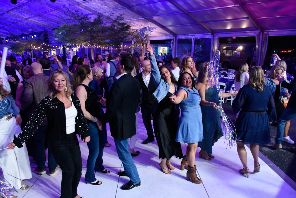Event guests dancing at the Denim and Diamonds Bash fundraising event supporting pediatric mental health at Luminis Health Anne Arundel Medical Center